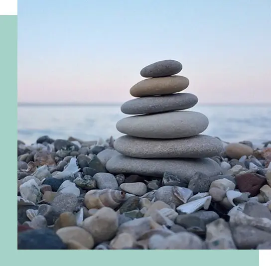 Stacked stones representing emotional balance and resilience after EMDR therapy.